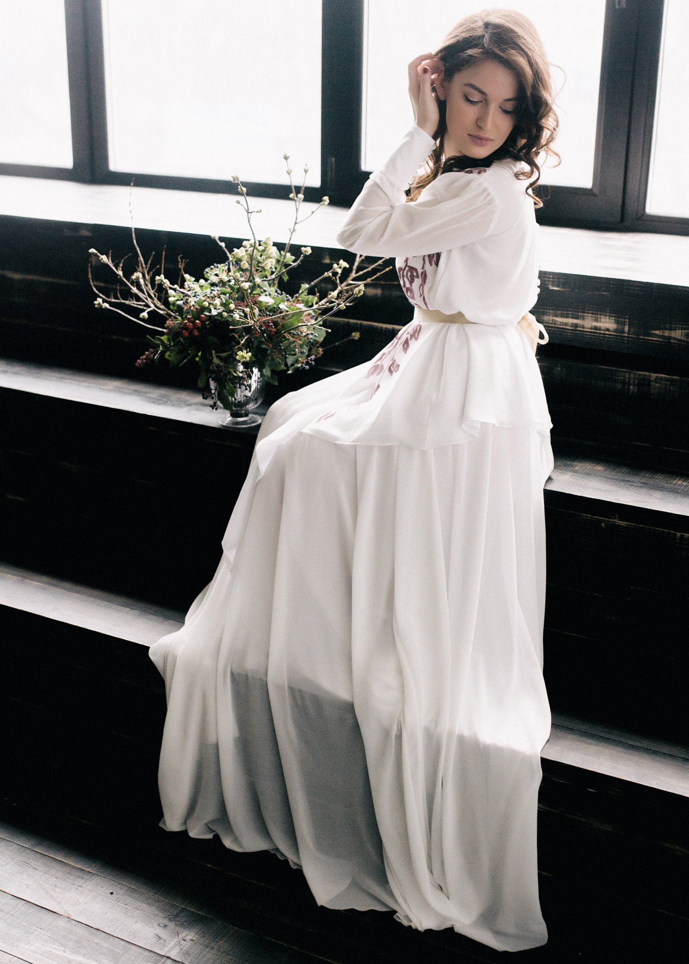 Off-white wedding dress with long bishop sleeve and layered skirt ...