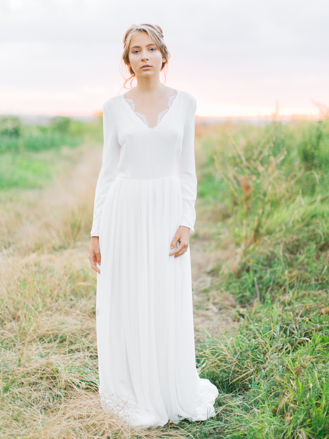 Off-white long sleeve wedding dress with v-neck scalloped bodice ...